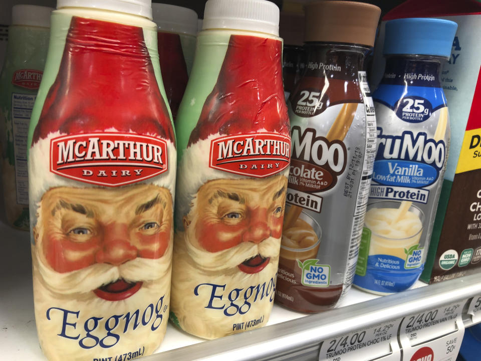 Bottles of McArthur Dairy Eggnog, a Dean Foods brand, are displayed at a grocery store, Tuesday, Nov. 12, 2019, in Doral, Fla. Dean Foods, America's biggest milk processor, filed for bankruptcy Tuesday amid a steep, decades-long drop-off in U.S. milk consumption blamed on soda, juices and, more recently, nondairy substitutes. (AP Photo/Wilfredo Lee)