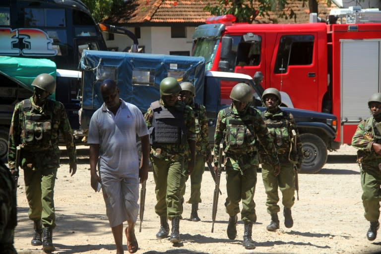 Officers patrol outside a police station in the Kenyan city of Mombasa on September 11, 2016 following an alleged attempted terror attack