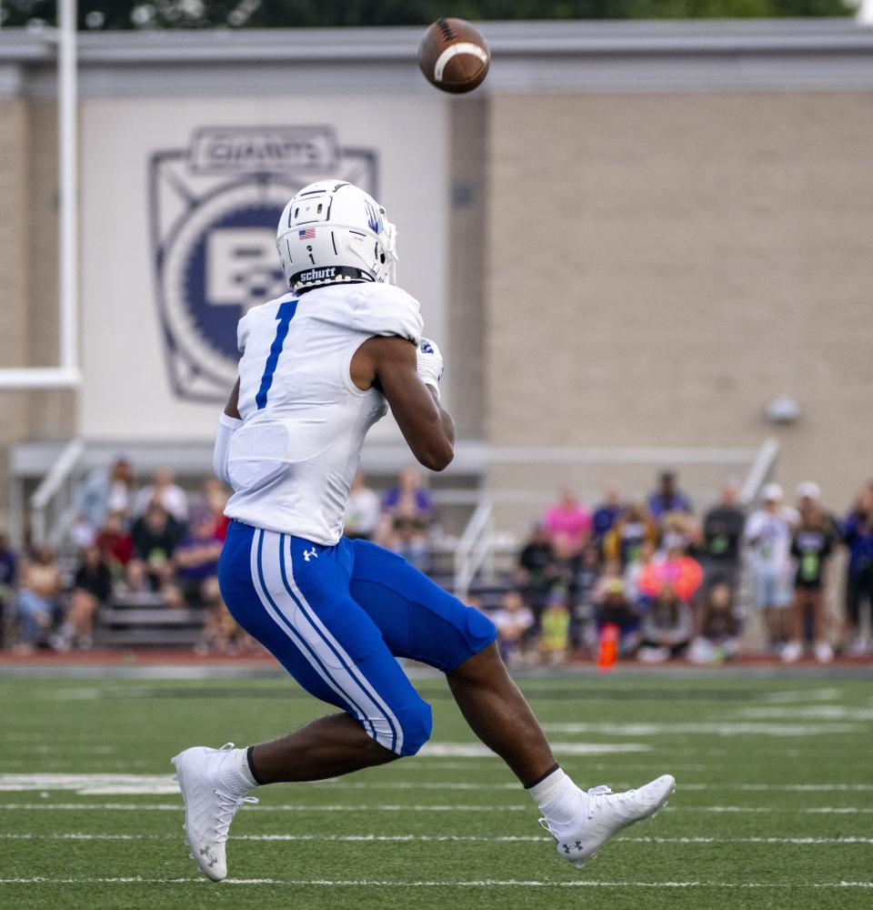 IMG Academy High School junior Donovan Olugbode (1) makes a catch during the first half of an IHSAA varsity football game against Ben Davis High School, Friday, September 8, 2023, at Ben Davis High School.