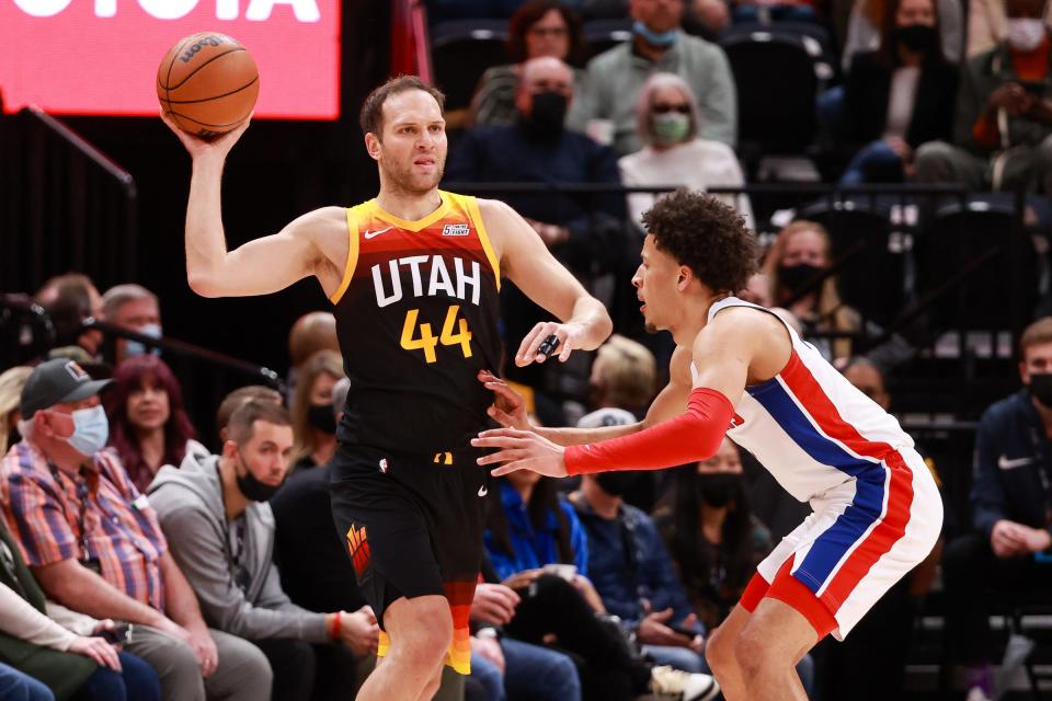 Utah Jazz forward Bojan Bogdanovic (44) passes the ball away from Detroit Pistons guard Cade Cunningham (2) during the first quarter at Vivint Arena on Jan. 21, 2022.