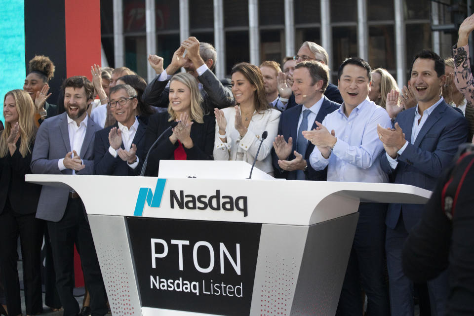 Peloton CEO John Foley, third from right, celebrates his company's IPO at the Nasdaq MarketSite, Thursday, Sept. 26, 2019, in New York. (AP Photo/Mark Lennihan)