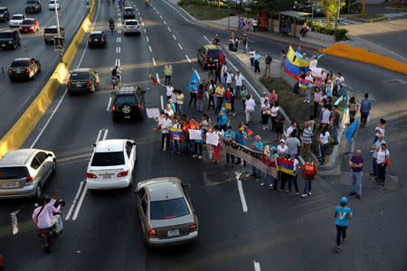 Opposition supporters block a highway during a protest against Venezuelan President Nicolas Maduro's government, in Caracas. REUTERS/Marco Bello