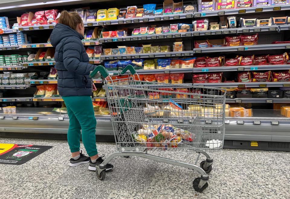 LONDON, UNITED KINGDOM - NOVEMBER 08: A shopper in a supermarket in London, Britain, on November 08, 2022 as new research revealed that food price rises with inflation to a record high of nearly 15 per cent. According to Kantar, the price of groceries, food and drinks has spiked and is set to continue rising as the cost of living crisis continues. Kantar found that more than a quarter of households are struggling financially - twice as many as this time last year. (Photo by Dinendra Haria/Anadolu Agency via Getty Images)