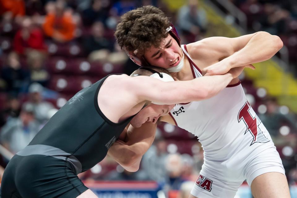 Faith Christian Academy's Gauge Botero, right, wrestles Athens Area's Gavin Bradley during a 113-pound semifinal bout at the PIAA Class 2A Wrestling Championships at the Giant Center on Friday, March 11, 2022, in Derry Township. Bradley won by decision, 4-1. 
