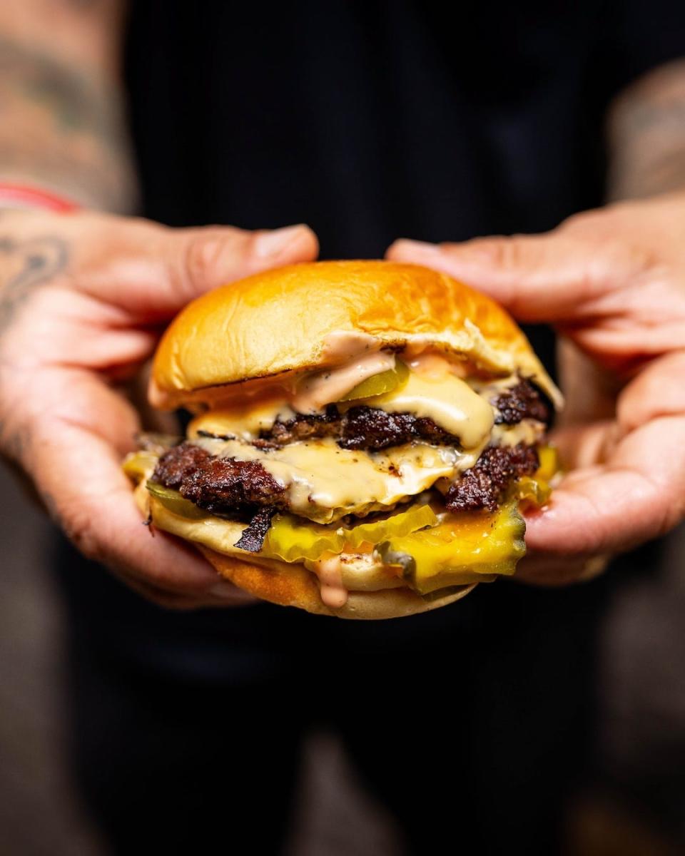 Chef Philip Frankland Lee (left) and professional skateboarder Neen Williams are partners in NADC Burger.