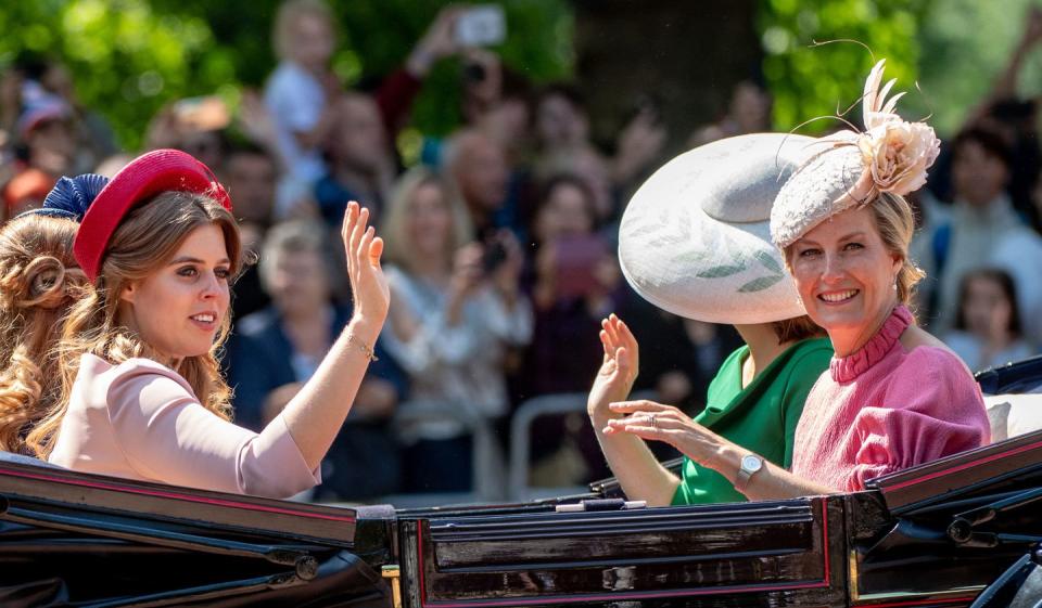 <p>Princess Beatrice and Sophie, Countess of Wessex wave to the crowds.</p>
