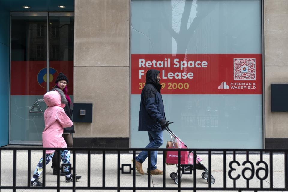 Retail space is vacant along Michigan Avenue Thursday, March 23, 2023, in Chicago. Along the iconic shopping and tourist strip known as the Magnificent Mile, storefronts sit vacant, casualties of the pandemic, crime and retail trends that were moving away from in-person shopping even before COVID-19. (AP Photo Erin Hooley)