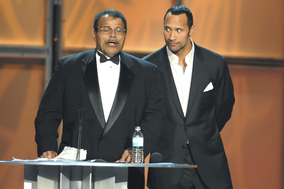 Actor Dwayne "The Rock" Johnson, right, with his father, Rocky Johnson, at the WWE Hall of Fame induction in 2008 in Orlando, Florida. (Photo: George Napolitano/MediaPunch/IPx)