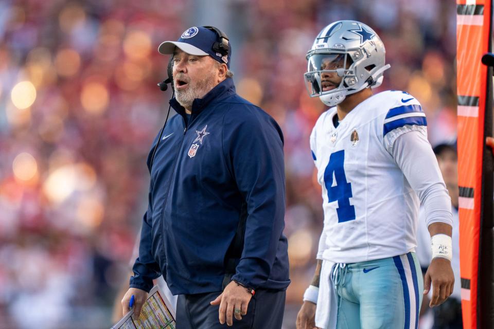 Dallas Cowboys head coach Mike McCarthy (left) and quarterback Dak Prescott (4) watch against the San Francisco 49ers during the first quarter at Levi's Stadium.