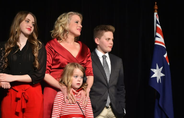 The daughter of the Leader of the Australian Labor Party Bill Shorten, Georgette (L), his wife Chloe (C), his daughter Clementine and son Rupert (R) watch as he speaks on stage