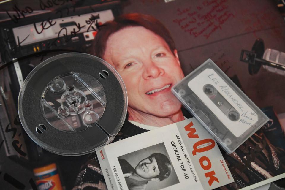 Photos of Lee Alexander, local radio host for 53 years, are seen on the table in his home in Greenville, SC, on Monday, Oct. 30, 2023.