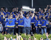 St. Louis Blues head coach Craig Berube holds the Stanley Cup overhead during the NHL hockey Stanley Cup victory celebration in St. Louis on Saturday, June 15, 2019. (AP Photo/Scott Kane)