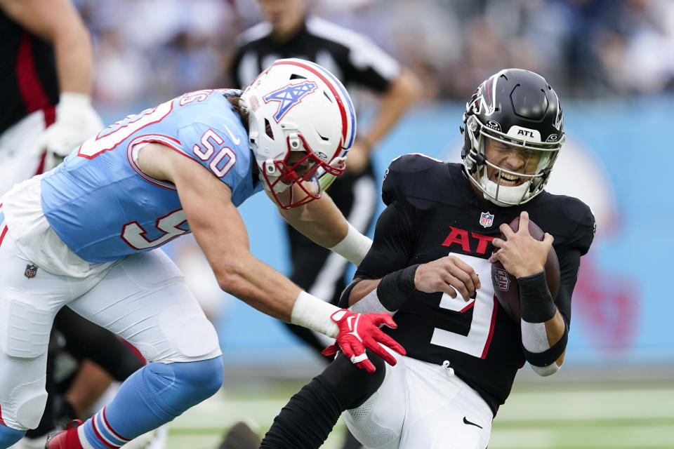 Atlanta Falcons quarterback Desmond Ridder (9) is hit by Tennessee Titans linebacker Jack Gibbens (50) during the first half of an NFL football game, Sunday, Oct. 29, 2023, in Nashville, Tenn. (AP Photo/George Walker IV)