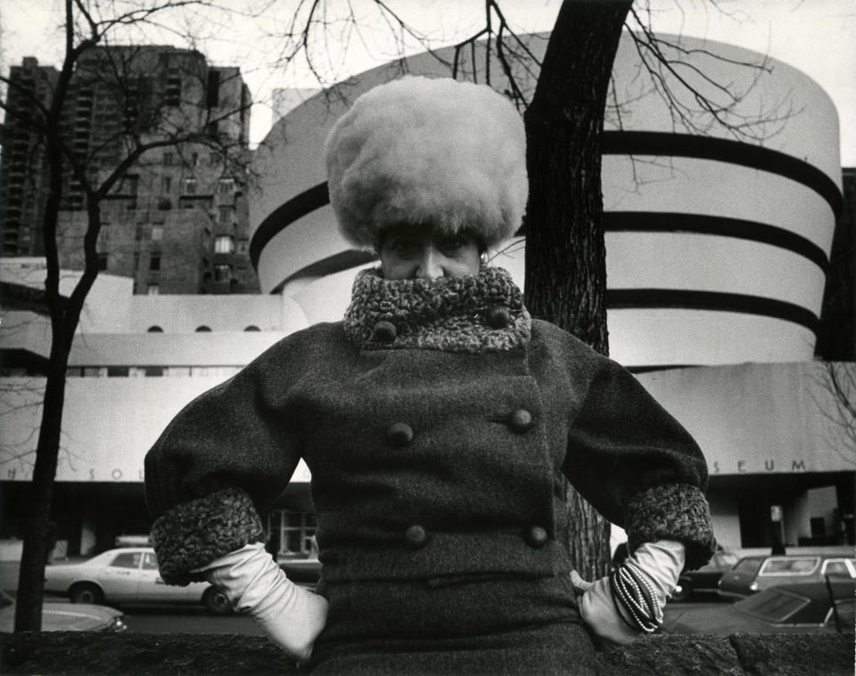 In this photo provided by the New-York Historical Society, photographer Bill Cunningham's muse, Editta Sherman, poses wearing a fur pillbox that playfully mimics the spiral lines of Frank Lloyd Wright's Guggenheim Museum, behind her, in New York. The photo is one of 88 prints from Bill Cunningham’s 1976-1978 project, “Facades,” featured in an exhibition at the New-York Historical Society, running through June 14, 2014. The images are a whimsical photo essay in which Cunningham posed models in period costumes against famous New York City historic sites of the same vintage. (AP Photo/Gift of Bill Cunningham via New-York Historical Society, Bill Cunningham)