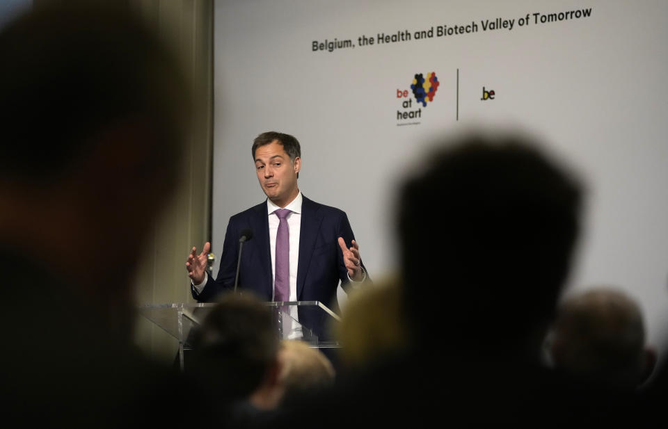 Belgium's Prime Minister Alexander De Croo addresses a conference on biotech at the Residence Palace in Brussels, Tuesday, Oct. 26, 2021. More than 100 Belgian and international executives from the health and biotech sector met in Brussels Tuesday to discuss a forward looking process in the development and production of COVID-19 vaccines. (AP Photo/Virginia Mayo)