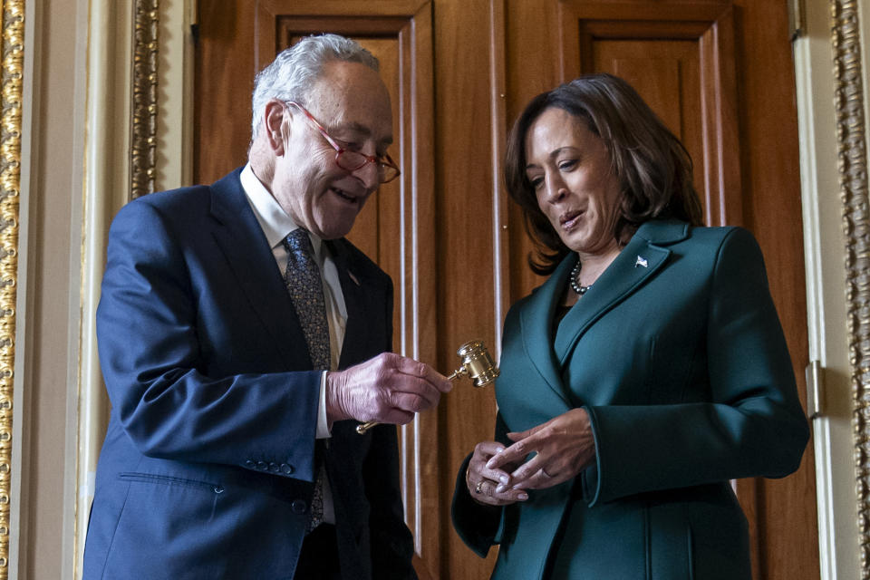 Senate Majority Leader Sen. Chuck Schumer, D-N.Y., presents Vice President Kamala Harris with a golden gavel after she cast the 32nd tie-breaking vote in the Senate, the most ever cast by a vice president, Tuesday, Dec. 5, 2023, on Capitol Hill in Washington. (AP Photo/Stephanie Scarbrough)