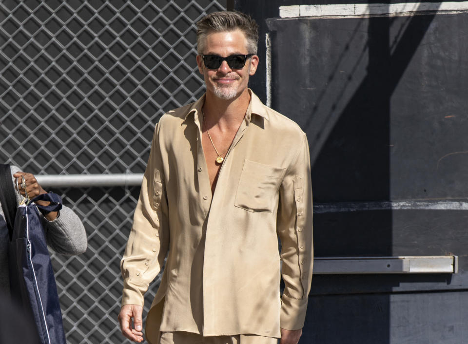 <p>Looking chic in an unbuttoned beige shirt, <a href="https://people.com/tag/chris-pine/" rel="nofollow noopener" target="_blank" data-ylk="slk:Chris Pine;elm:context_link;itc:0;sec:content-canvas" class="link ">Chris Pine</a> glows outside of <em>Jimmy Kimmel Live!</em> in L.A. on March 27. </p>