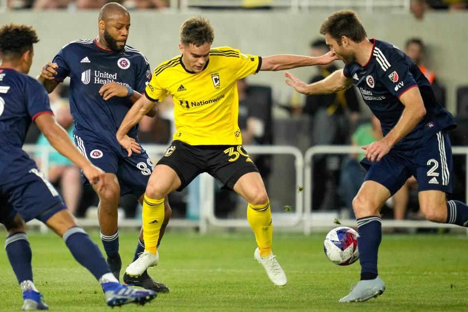 Apr 15, 2023; Columbus, Ohio, United States; Columbus Crew defender Will Sands (30) contests the ball with New England Revolution defender Dave Romney (2) during the first half of the MLS soccer game between Columbus Crew and New England Revolution at Lower.com Field on Saturday evening. Mandatory Credit: Joseph Scheller-The Columbus Dispatch

Mls Ceb Crew New England New England At Crew