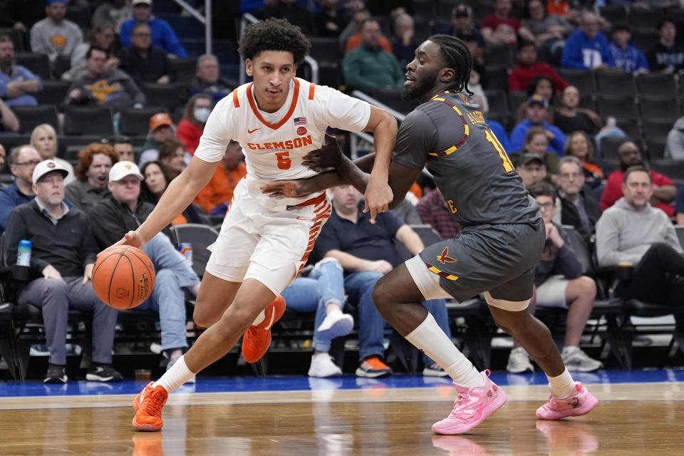 Clemson forward Jack Clark (5) driving around Boston College guard Prince Aligbe (10) during the second half of the Atlantic Coast Conference NCAA college basketball tournament Wednesday, March 13, 2024, in Washington. (AP Photo/Alex Brandon)