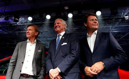 Volvo Cars President & CEO Håkan Samuelsson (L) and Senior Vice President Americas, Anders Gustafsson (R) pose for photos with South Carolina Governor Henry McMaster during the inauguration of Volvo Cars first U.S. production plant in Ridgeville, South Carolina, U.S., June 20, 2018. REUTERS/Randall Hill