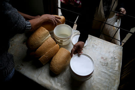 Food is distributed to the internally displaced people at a reception center where IDPs live, in Mihatovici, near Tuzla, Bosnia and Herzegovina, October 2, 2018. REUTERS/Dado Ruvic