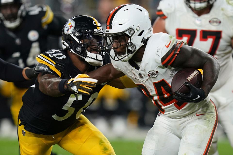 Cleveland Browns running back Jerome Ford is tackled by Pittsburgh Steelers linebacker Elandon Roberts (50) during the second half Monday in Pittsburgh.