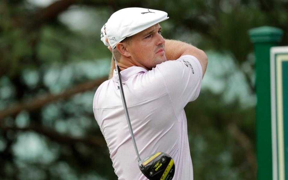 Bryson DeChambeau hits from the 11th tee during the first round of the Memorial golf tournament - AP