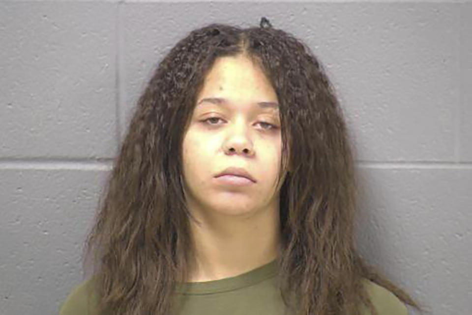 This photo provided by Will County Sheriff’s Office shows Kyleigh Cleveland-Singleton, 21, of Joliet, Ill. Authorities say Cleveland-Singleton, the girlfriend of a man suspected of fatally shooting seven relatives and an eighth person last weekend in a Chicago suburb has been charged with obstruction for allegedly trying to prevent her boyfriend’s apprehension. Joliet police say 21-year-old Kyleigh Cleveland-Singleton was charged with one count of obstructing justice by the Will County State’s Attorney Office. (Will County Sheriff’s Office via AP)