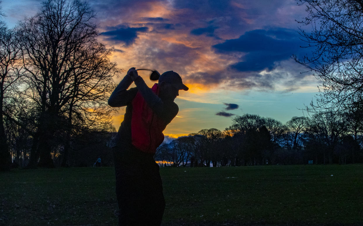 A golfer tees off at Allerton Manor Golf Club in Liverpool on the first day of a major easing of England's coronavirus lockdown to allow far greater freedom outdoors. Picture date: Monday March 29, 2021.