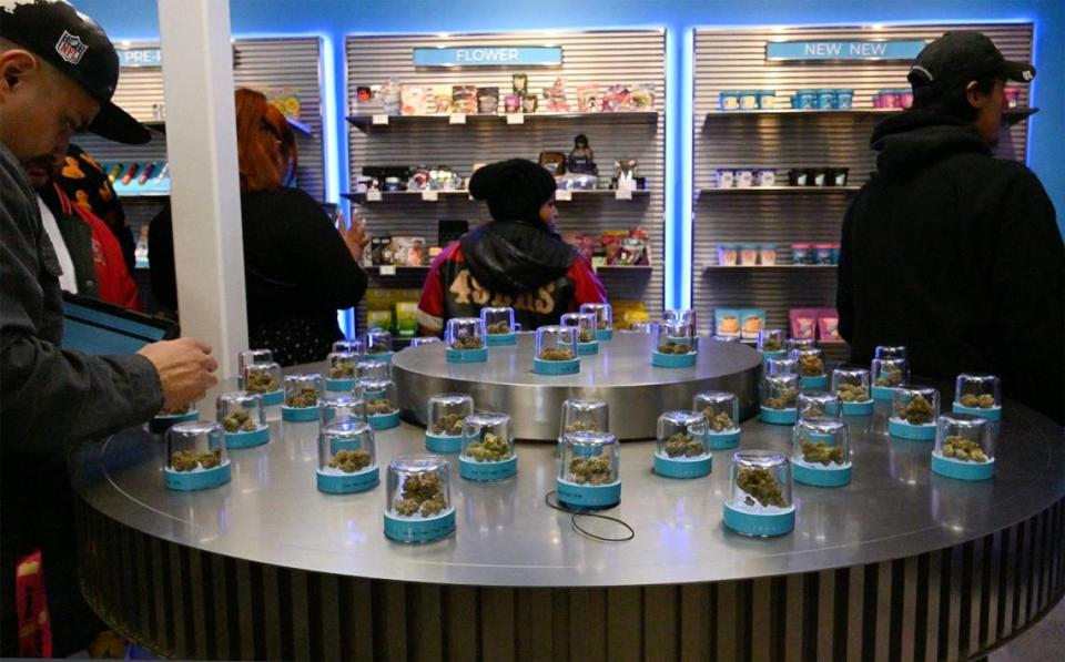 Strains of marijuana are seen displayed for sale at the grand opening of Cookies, Fresno’s newest cannabis dispensary Sunday morning, Dec. 17, 2023.