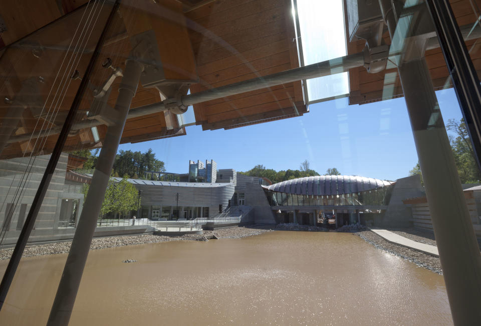 In this Thursday, Oct. 13, 2011 photo, water partially fills a stream flowing under buildings at Crystal Bridges Museum of American Art in Bentonville, Ark. Nearly four months after opening in November, the museum has already had over 175,000 visitors. (AP Photo/Danny Johnston)