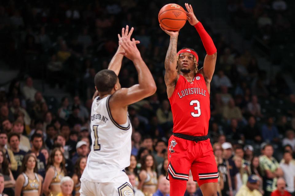 Feb 25, 2023; Atlanta, Georgia, USA; Louisville Cardinals guard El Ellis (3) shoots past Georgia Tech Yellow Jackets guard Kyle Sturdivant (1) in the first half at McCamish Pavilion. Mandatory Credit: Brett Davis-USA TODAY Sports