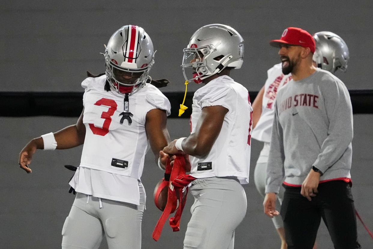 Mar 7, 2024; Columbus, OH, USA; Ohio State Buckeyes safety Ja'Had Carter (3) talks to safety Caleb Downs (2) during spring football practice at the Woody Hayes Athletic Center.