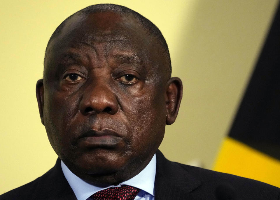 South Africa's President Cyril Ramaphosa looks on during the final report of a judicial investigation into corruption by Chief Justice Raymond Zondo at Union Building in Pretoria, South Africa, Wednesday, June 22, 2022. The probe has laid bare the rampant corruption in government and state-owned companies during former President Jacob Zuma’s tenure from 2009 to 2018. (AP Photo/Themba Hadebe)