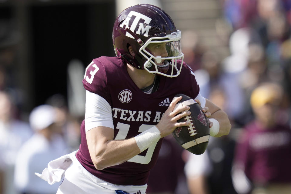 FILE - Texas A&M quarterback Haynes King (13) runs against Florida during the first half of an NCAA college football game Nov. 5, 2022, in College Station, Texas. Former Texas A&M quarterback King has claimed the starting job at Georgia Tech. Coach Brent Key announced Tuesday, Aug. 22, 2023, that King will start the Sept. 1 opener against Atlantic Coast Conference rival Louisville. (AP Photo/Sam Craft, File)