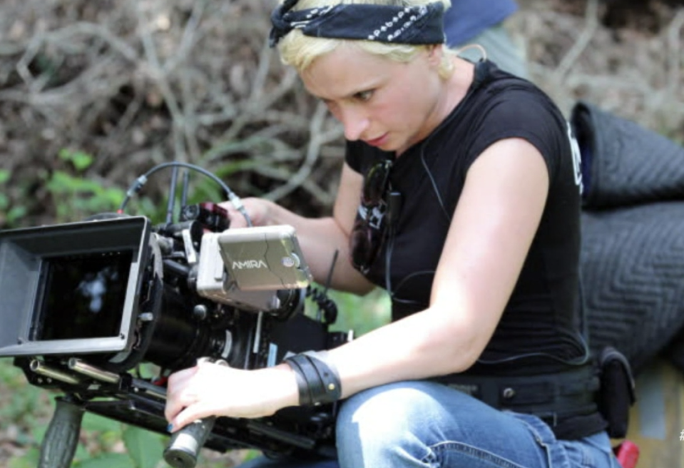 A photo of Halyna operating a camera