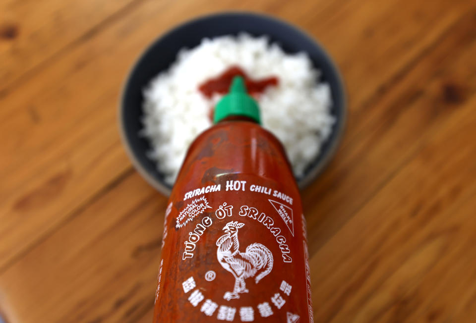 SAN ANSELMO, CALIFORNIA - JUNE 10: In this photo illustration, a bottle of Huy Fong Foods Sriracha sauce is displayed on June 10, 2022 in San Anselmo, California. Due to a shortage of the chili peppers used to make Sriracha hot sauce, the popular condiment is becoming hard to find on store shelves. Huy Fong Foods announced that it will temporarily suspend production and will be unable to fill orders placed after mid-April. (Photo Illustration by Justin Sullivan/Getty Images)