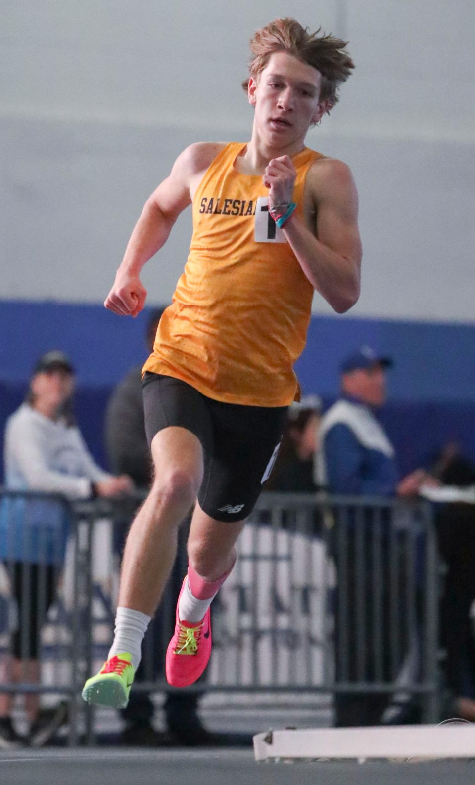 Salesianum's Ethan Walther puts some distance between him and the competition as he wins the 1600 meter run during the DIAA indoor track and field championships at the Prince George's Sports and Learning Complex in Landover, Md., Saturday, Feb. 3, 2024.