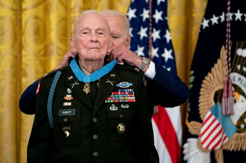 U.S. President Joe Biden places the Medal of Honor on Col. Ralph Puckett during a ceremony in the East Room of the White House in Washington D.C., on May 21, 2021. Following his death on April 8, his body lie in honor at the U.S. Capitol on Monday. File Pool Photo by Stefani Reynolds/UPI