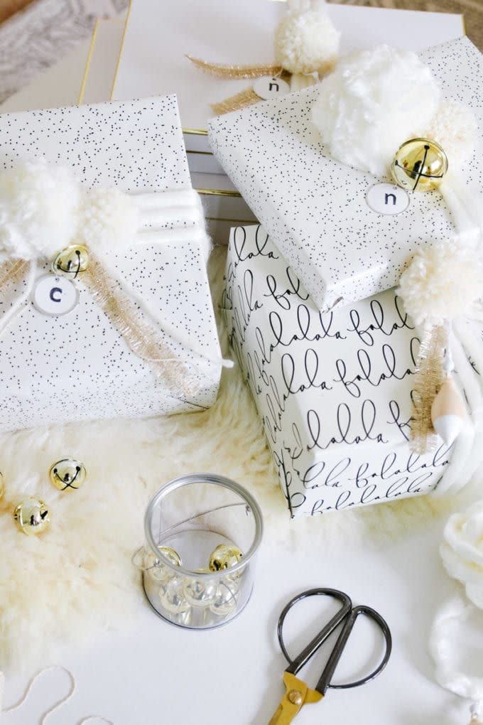 <p>Pom-poms aren't just for the top of your winter hat! You can weave that coziness into your holiday gifts with handmade pom-poms and jingling gold bells.<br></p><p><strong>Get the tutorial at <a href="https://www.modern-glam.com/pom-pom-gift-wrap-for-christmas/" rel="nofollow noopener" target="_blank" data-ylk="slk:Modern Glam" class="link rapid-noclick-resp">Modern Glam</a>. </strong> </p>