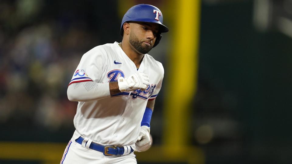 Texas Rangers' Ezequiel Duran runs the bases after hitting a solo home run against the Houston Astros during the fifth inning of a baseball game in Arlington, Texas, Tuesday, Aug. 30, 2022. (AP Photo/Tony Gutierrez)