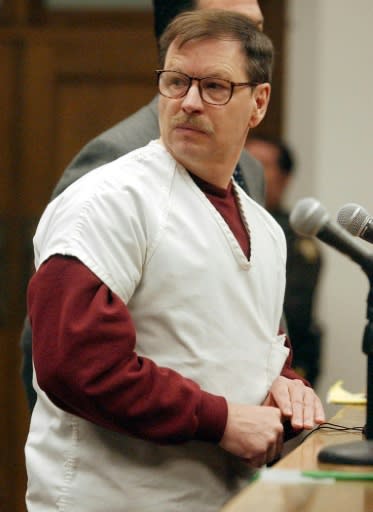American Gary Ridgway, the 'Green River Killer', looks over at relatives of his victims during his trial in a Seattle court in 2003
