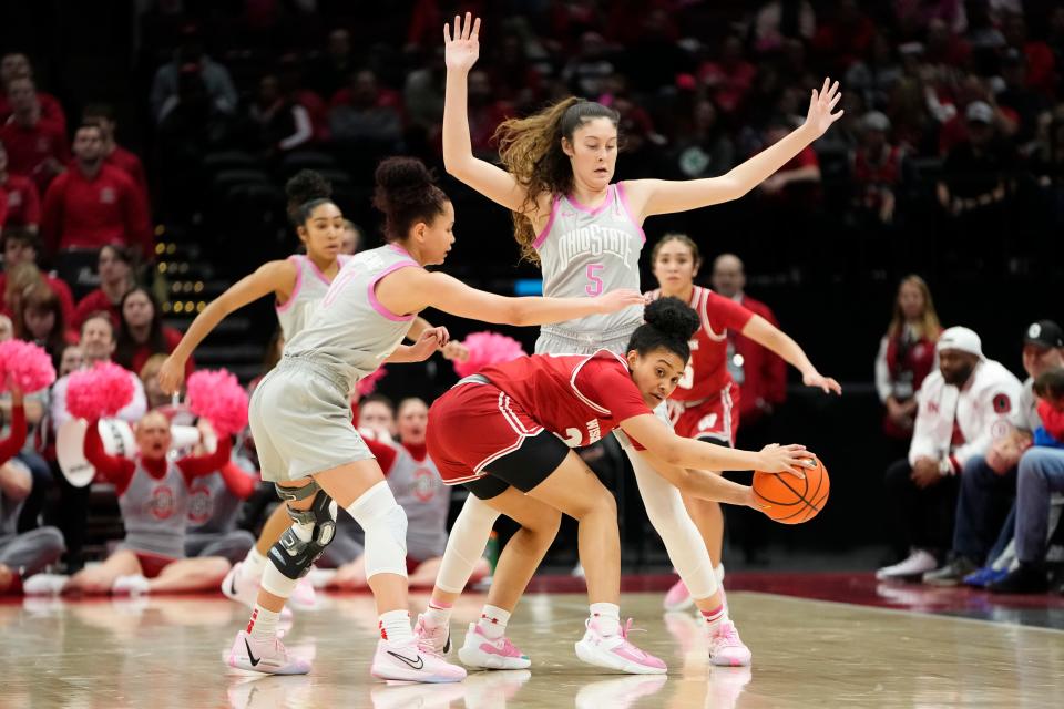 Feb 1, 2024; Columbus, OH, USA; Ohio State Buckeyes guard Emma Shumate (5) and guard Madison Greene (0) trap Wisconsin Badgers guard D'Yanis Jimenez (23) during the second half of the NCAA women’s basketball game at Value City Arena. Ohio State won 87-49.