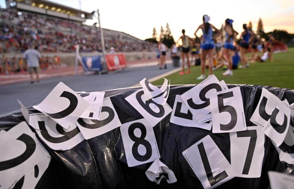 Runner’s numbers are seen disposed of in a trash can at the CIF Central Section Masters track and field meet, held at Veterans Memorial Stadium on Saturday, May 20, 2023 in Clovis.