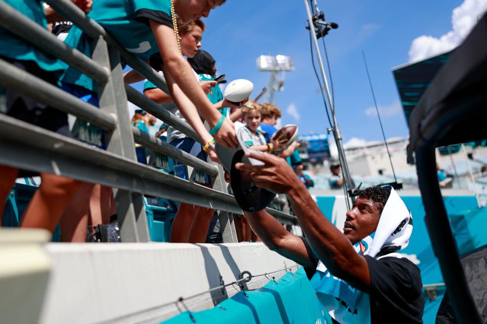 Jacksonville Jaguars wide receiver Zay Jones (7) signs autographs for fans before a NFL football game between the Jacksonville Jaguars and the Kansas City Chiefs Sunday, Sept. 17, 2023 at EverBank Stadium in Jacksonville, Fla. [Corey Perrine/Florida Times-Union]