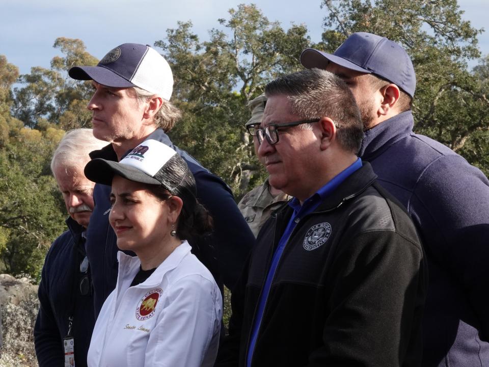 Gov. Gavin Newsom, at left in hat, appeared with area officials including state Sen. Monique Limón, center, and Rep. Salud Carbajal in Montecito on Friday.