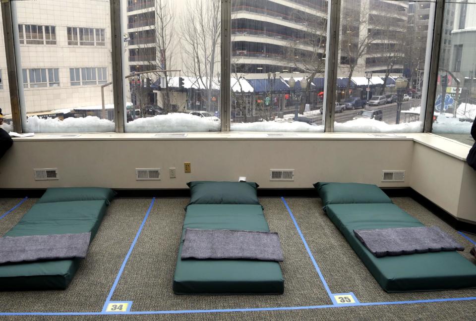 Beds in a new homeless shelter, slated to open later in the evening, are show in Portland, Ore., Tuesday, Jan. 17, 2017. A stillborn infant was found with his homeless mother at a Portland bus stop in the cold earlier this month and,while the infant's death was not blamed on the cold, it has drawn more attention to an unusually harsh winter that has led to several exposure deaths among the city's homeless. (AP Photo/Don Ryan)