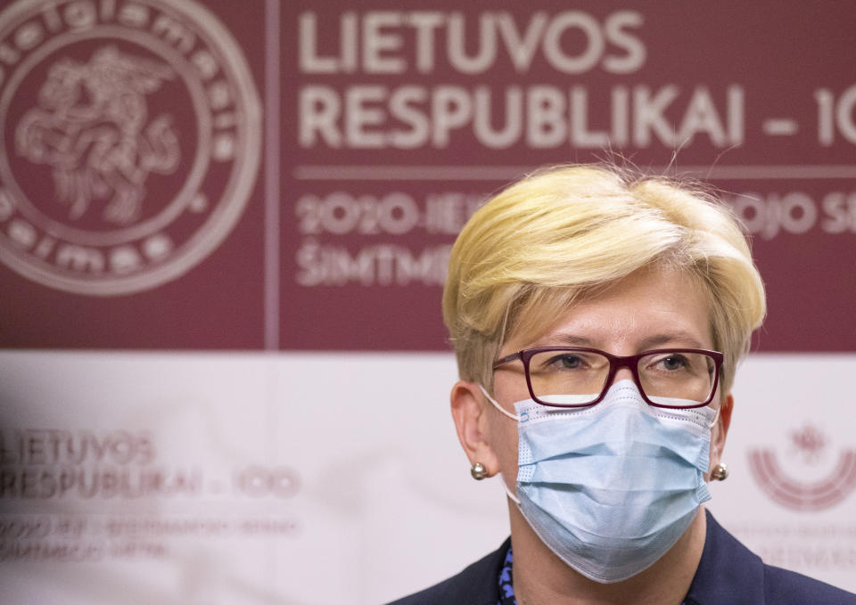 Newly elected prime minister Ingrida Simonyte, speaks to the media, at the Parliament in Vilnius, Lithuania, Tuesday, Nov. 24, 2020. Lithuania's parliament approved Ingrida Simonyte as the new prime minister on Tuesday. (AP Photo/Mindaugas Kulbis)