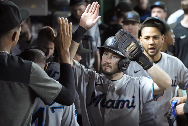 A.J. Puk of the Miami Marlins celebrates with Brant Brown hitting