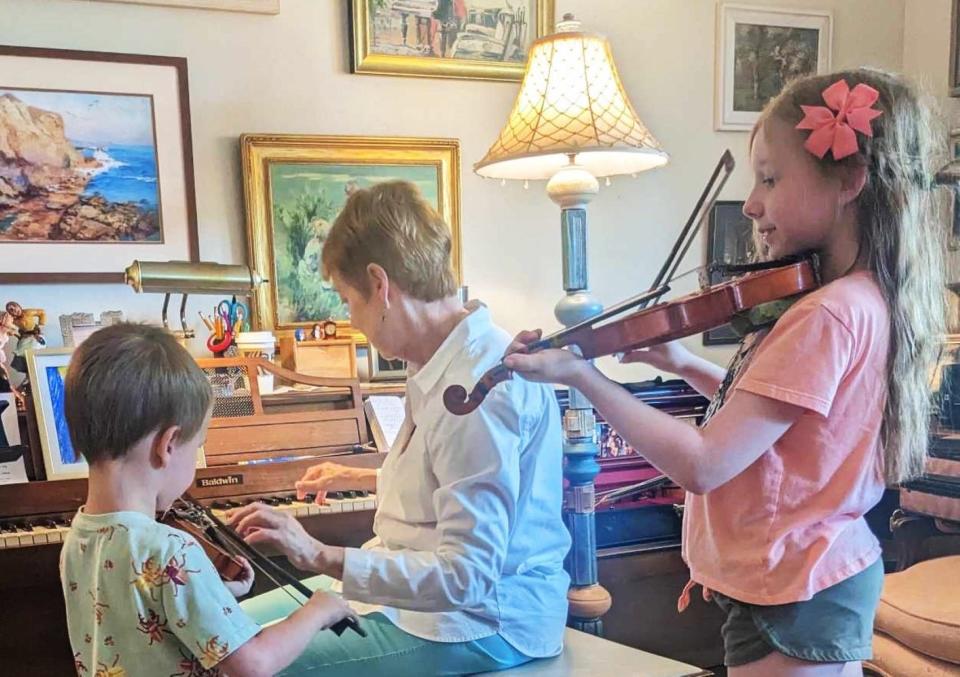 Samantha Robarts, 9, a homeschool student working with her violin instructor.